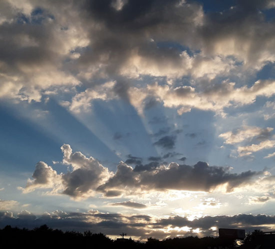 A sunset with crepuscular rays over Hickory, North Carolina, US.