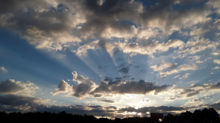 A sunset with crepuscular rays over Hickory, North Carolina, US.