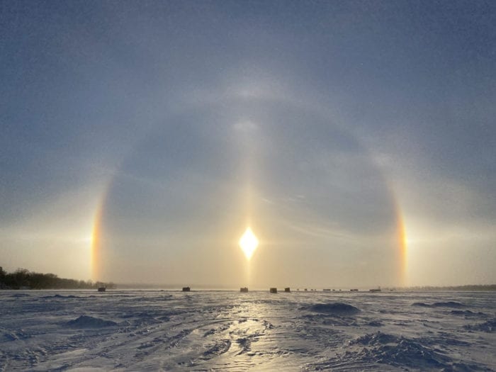 A halo and sundogs in diamond dust over Little Detroit Lake, US.