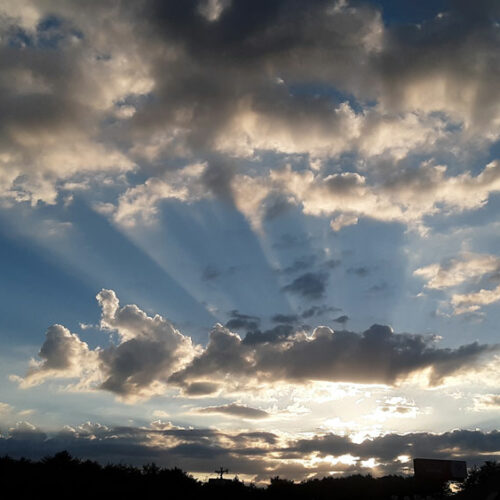 A sunset with crepuscular rays over Hickory, North Carolina, US.