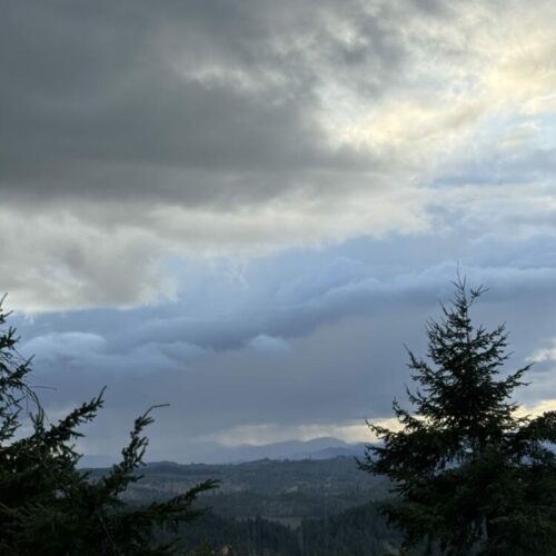 Shortly before sunset, precipitation falling in the distance as storm clouds developed near Eugene, Oregon, US